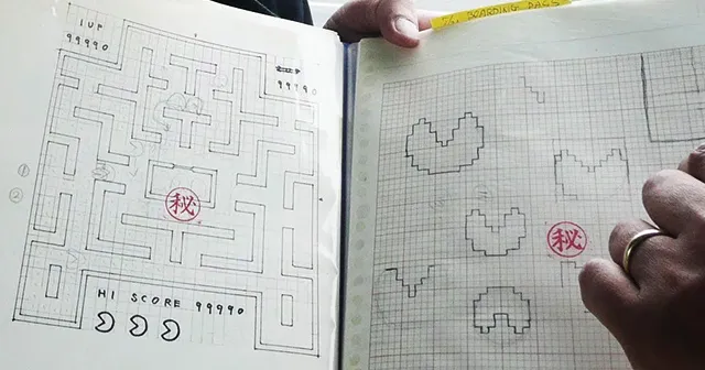 Original concept drawings of Pac-Man by Toru Iwatani. On the right are the 2D pixel sketches of Pac-Man, while on the left are concept sketches of the map of the game.